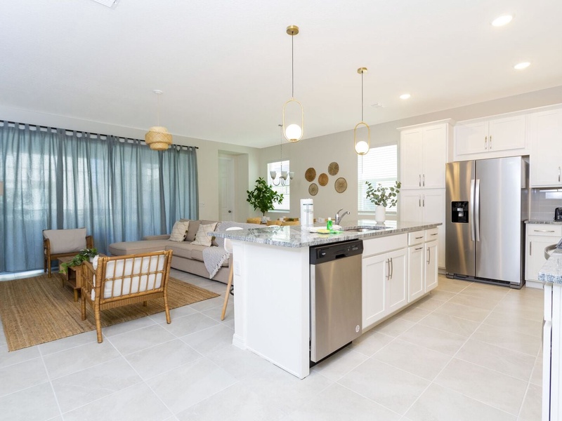 The living room, dining room and kitchen perfectly integrate into one ambience, ideal for socializing during the holidays.