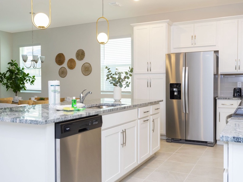 The kitchen features stainless steel appliances with all you need to prepare delicious meals.