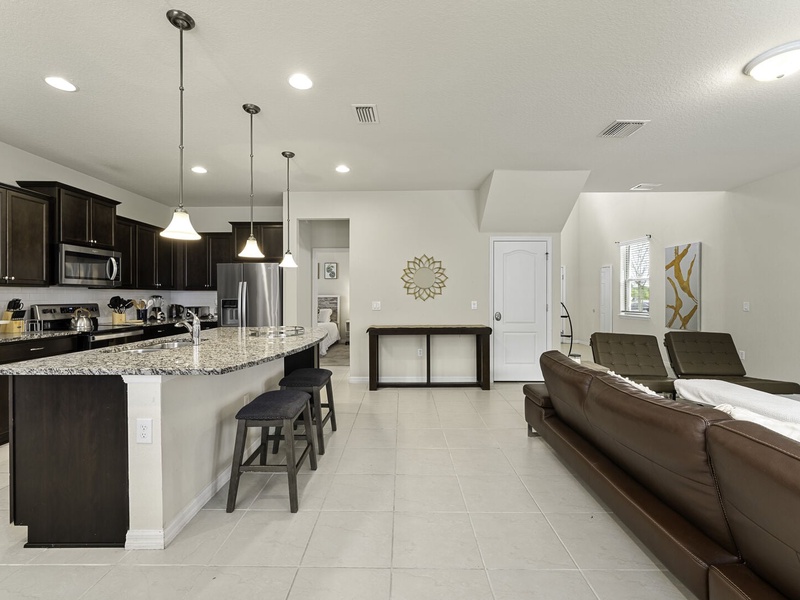 The living room, dining room and kitchen perfectly integrate into one ambience, ideal for socializing during the holidays.