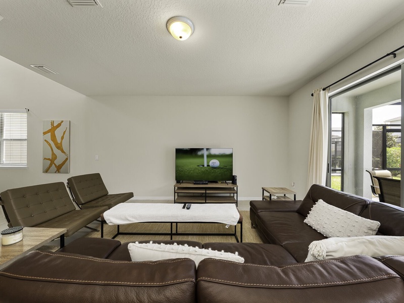 Enjoy a movie night in our living room with ample plush seating.