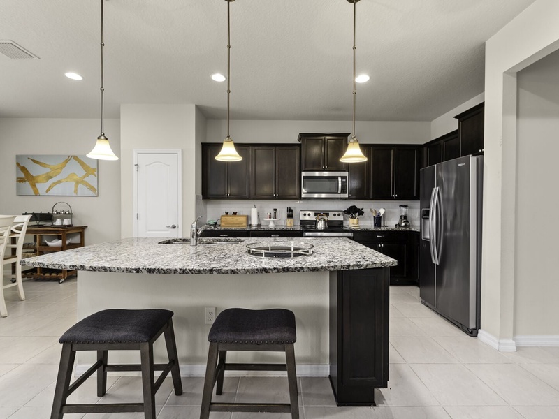 Fully equipped kitchen with stainless steel appliances.