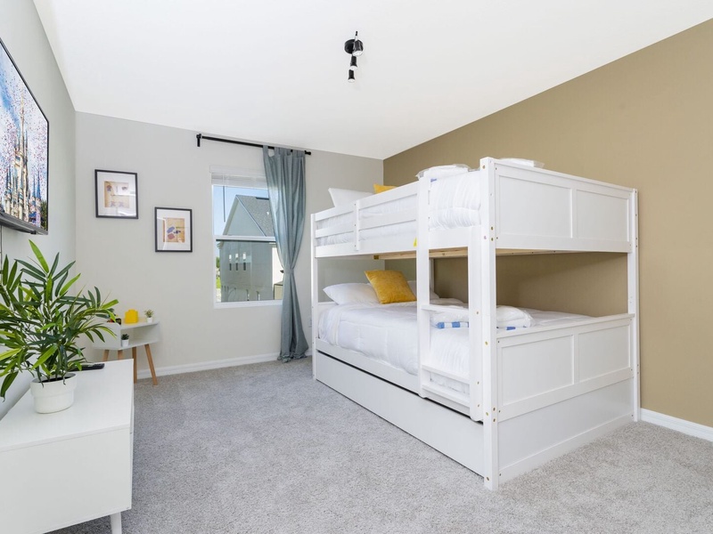 Each bedroom comes with its own TV, perfect for relaxing after a long day at the parks.