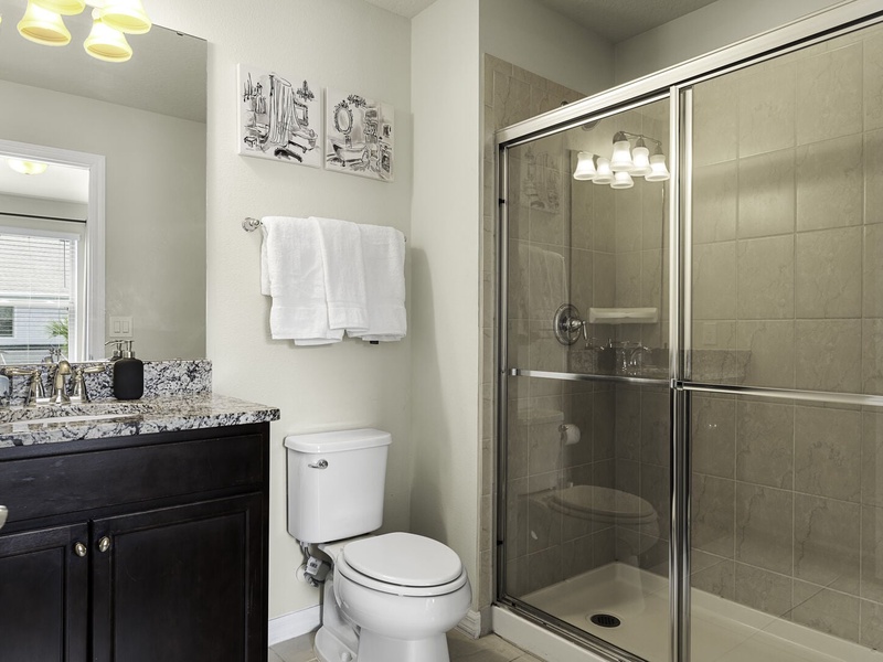 Full private bathroom with fresh towels and complimentary toiletries for your convenience.