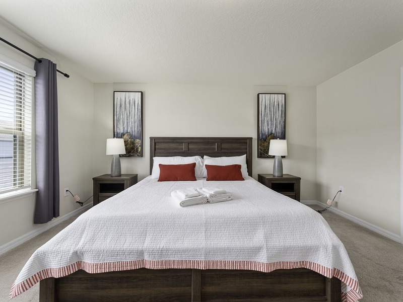 Relax in our comfortable master bedroom featuring a king size bed and full private bathroom.