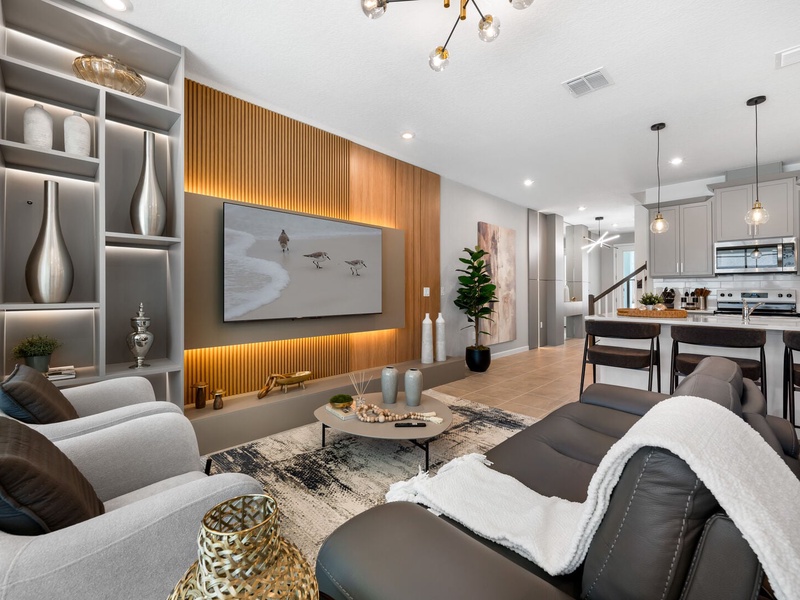 Enjoy a movie night in our cozy living room, complete with a large-screen TV and comfortable plush seating.