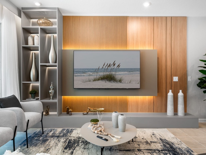 Enjoy a movie night in our cozy living room, complete with a large-screen TV and comfortable plush seating.