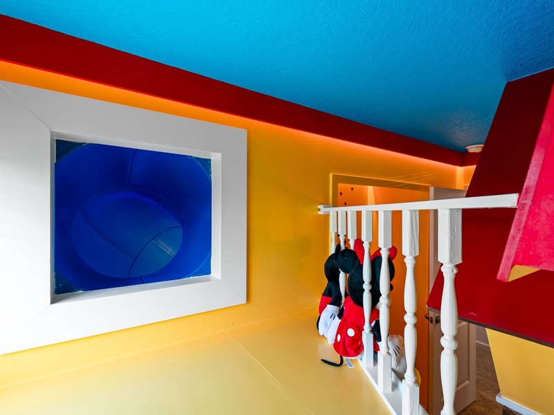 The fun continues upstairs... slide from the bunk into a secret passage linking the Minions and Mario Bros rooms!