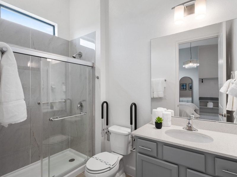 This bathroom has been thoughtfully designed to provide comfort, safety, and convenience for guests with reduced mobility.