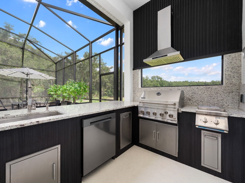 Enjoy cooking in our fully-equipped outdoor kitchen, complete with a grill, sink, and bar seating.