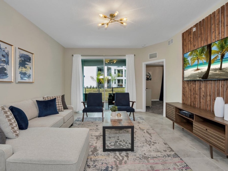 The living room is perfect for movie nights, with a Smart TV and plush seating.