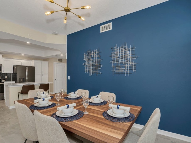 Dine in comfort at a 6-seat dining table, conveniently connected to the kitchen and living room.