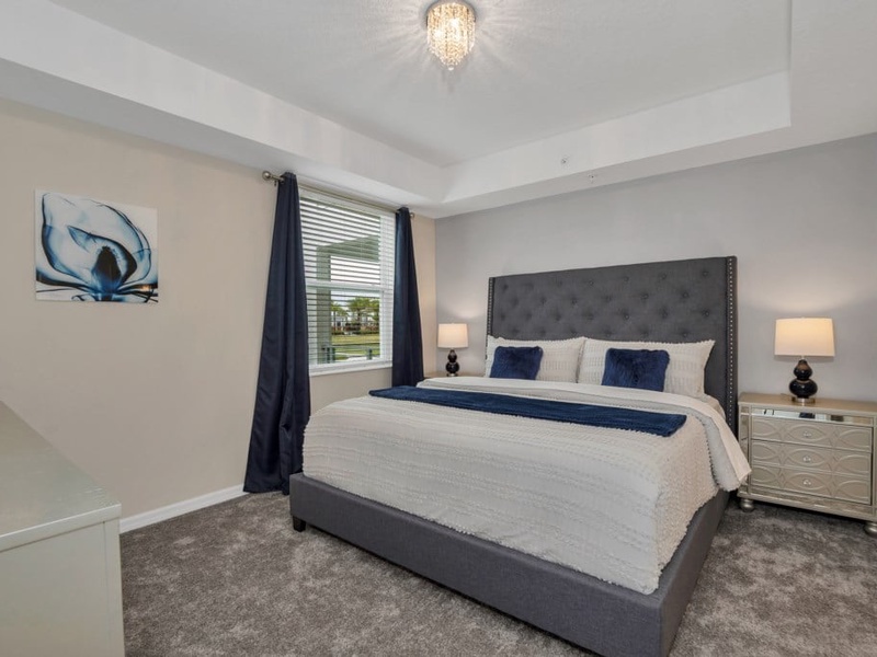Our master bedroom features a king-size bed, TV, and private bathroom.