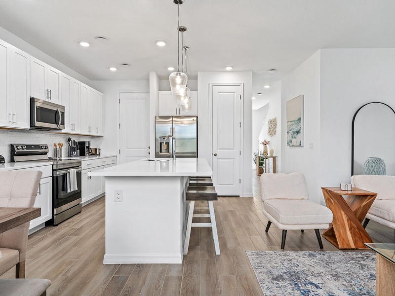 The living room, dining area and kitchen perfectly integrate into one ambience, ideal for socializing during the holidays.