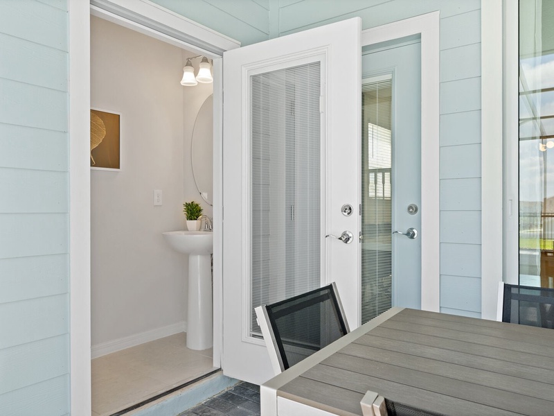 There is a half bathroom by the pool area for your convenience.
