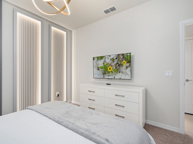Each bedroom includes a TV, offering a private space to unwind after a day at the parks.