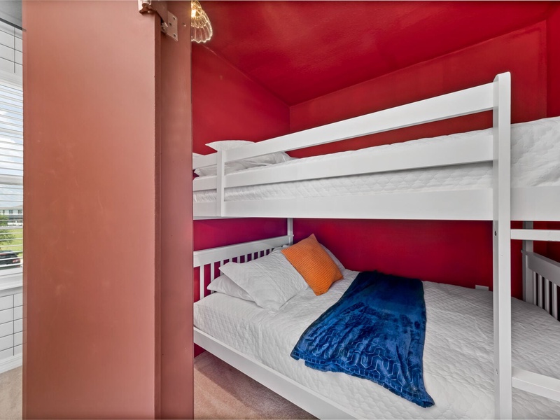 This room features a bunk bed with double beds on each level.