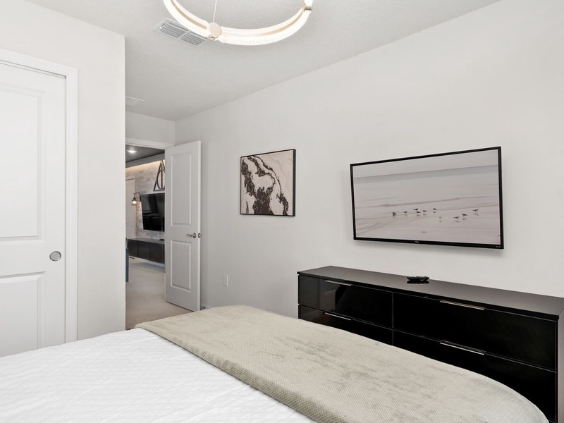 Each bedroom includes a TV, offering a private space to unwind after a day at the parks.