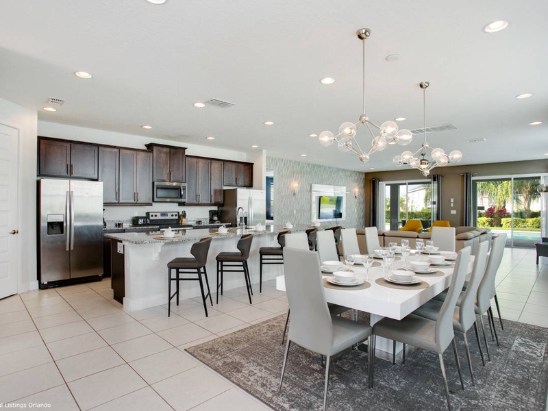 The living room, dining room and kitchen perfectly integrate into one ambience, ideal for socializing during the holidays.