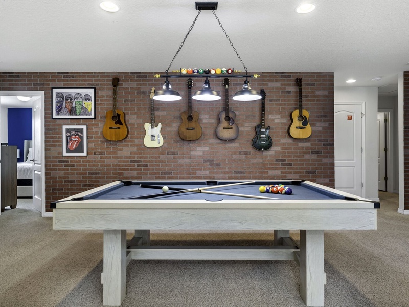 In need of more entertainment? Our second TV room features a pool table!