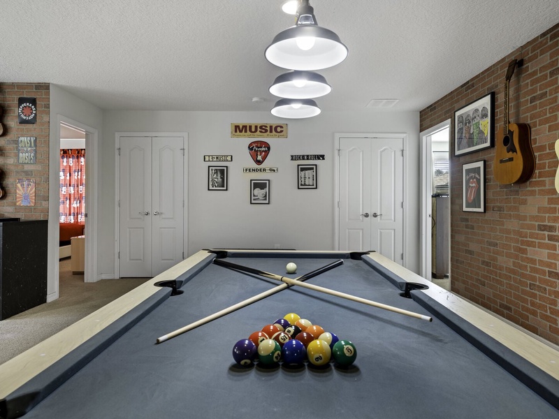 Looking for more entertainment? Our second TV room offers a pool table, a poker table, and plenty of cozy seating for a perfect movie night.