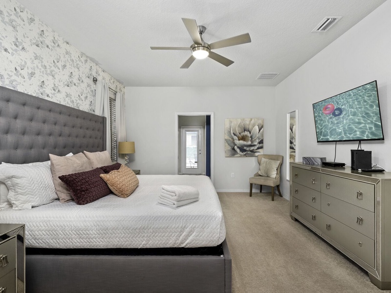 Our master bedroom features its own bathroom with access to the pool area.