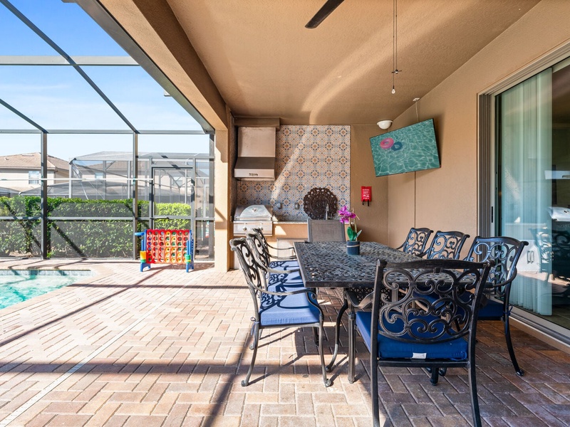 The outdoor dining area features a table that comfortably seats 8 people