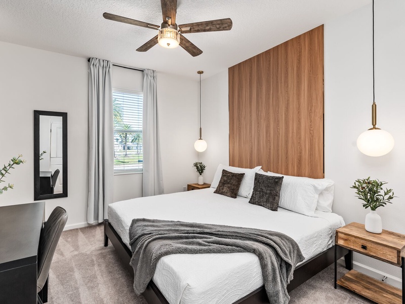 Each bedroom features comfortably appointed beds, a work desk, TV, and a private ensuite bathroom.