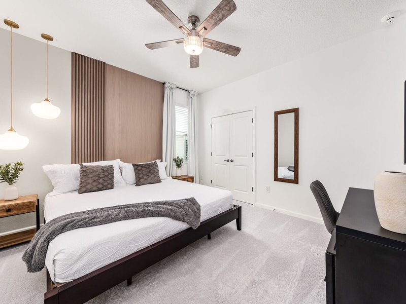 Each bedroom features comfortably appointed beds, a work desk, TV, and a private ensuite bathroom.