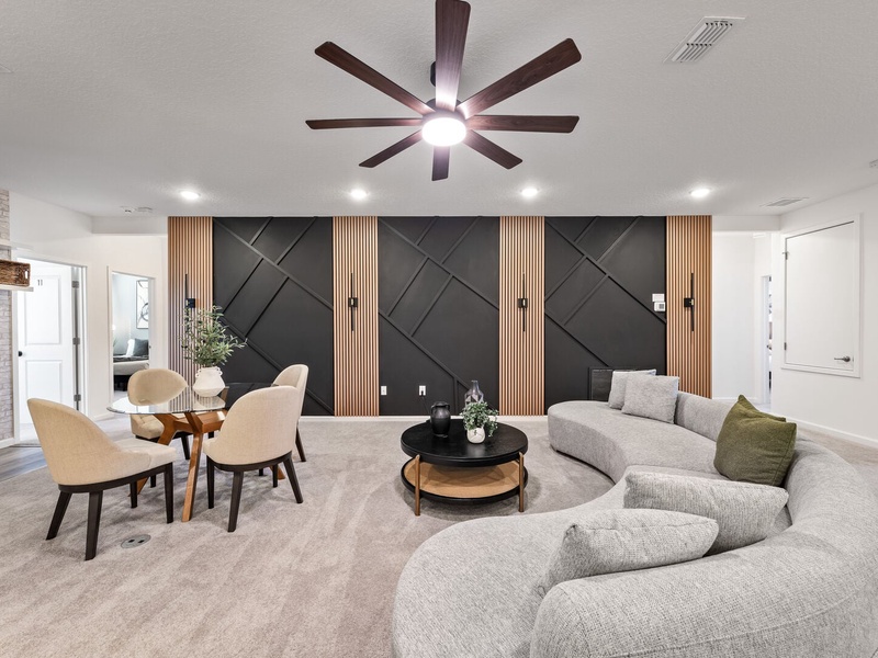 Designed for relaxation and connection, this lounge offers a coffee station, modern furnishings, and a warm, inviting atmosphere.