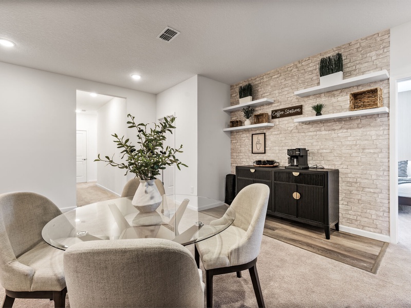 Designed for relaxation and connection, this lounge offers a coffee station, modern furnishings, and a warm, inviting atmosphere.