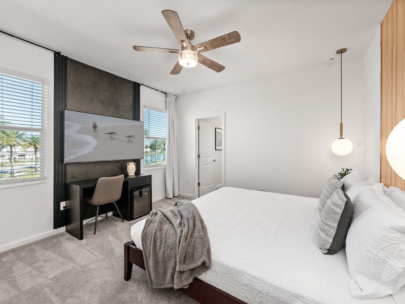Each bedroom features comfortably appointed beds, a work desk, TV, and a private ensuite bathroom.