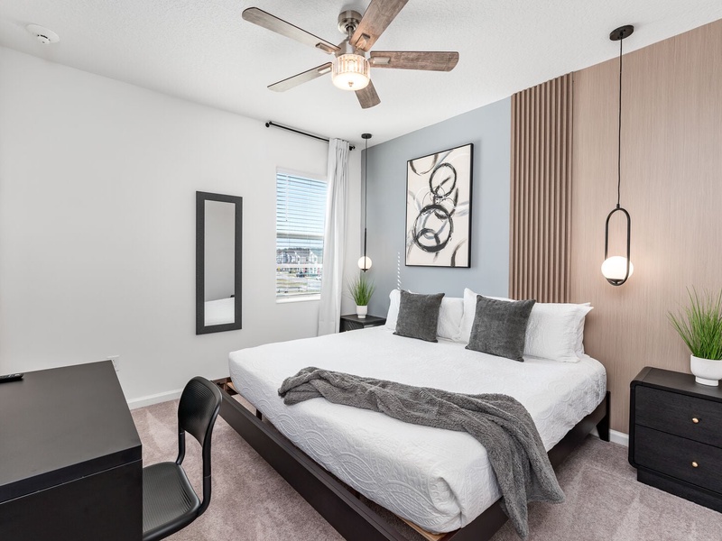 Each bedroom features comfortably appointed beds, a work desk, TV, and a private ensuite bathroom.