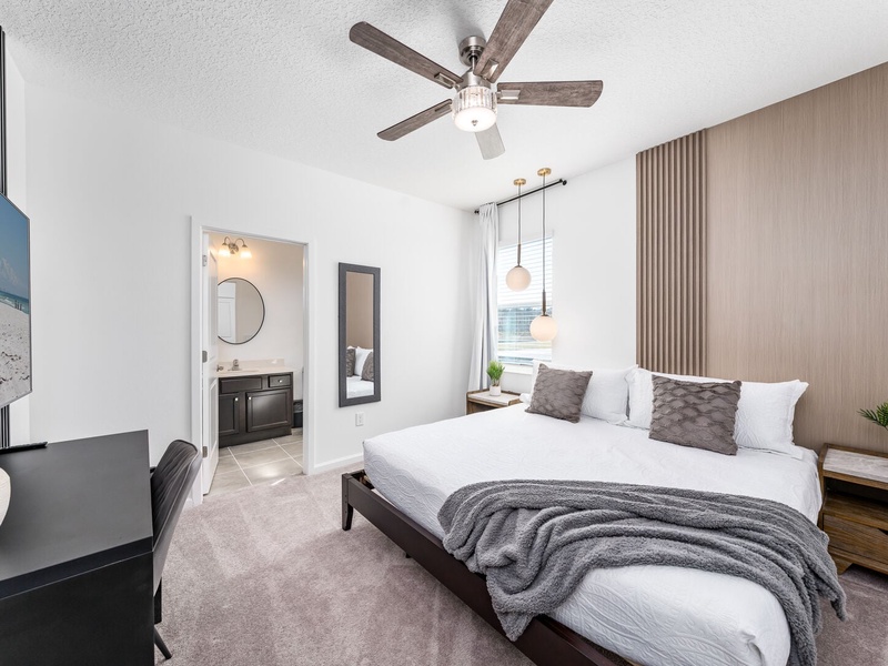 Each bedroom features comfortably appointed beds, a work desk, TV, and a private ensuite bathroom.