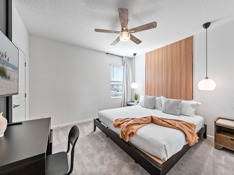 Each bedroom features comfortably appointed beds, a work desk, TV, and a private ensuite bathroom.
