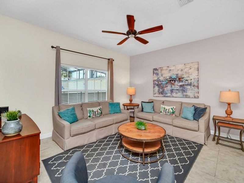 Relax in our cozy living room, perfect for unwinding after a long day at the parks.