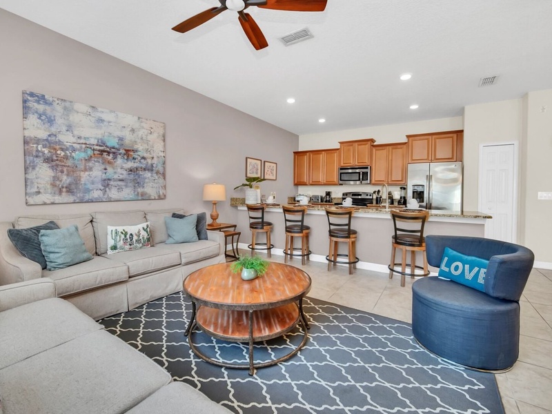 The space perfectly integrates the living room, dining room and kitchen.