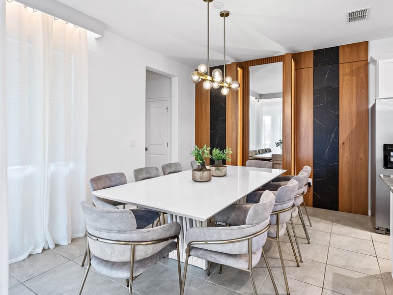 Enjoy meals together in the dining room with seating for 8.