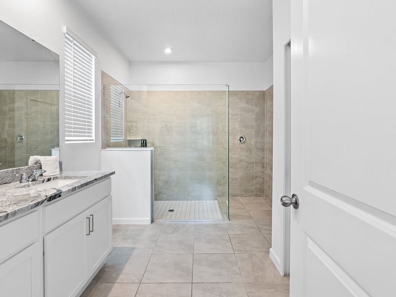 Walk-in shower in a modern bathroom.