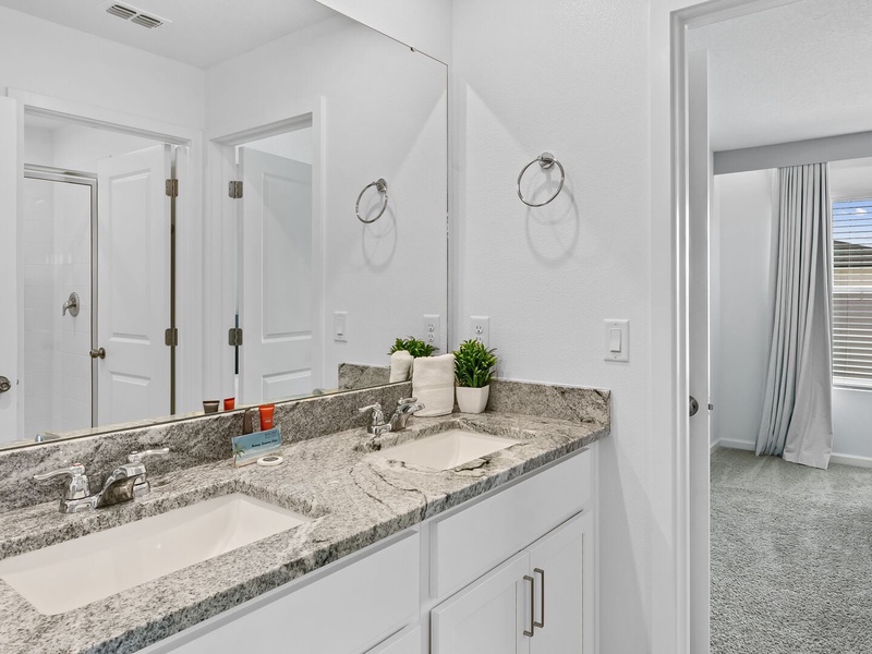 Convenient Jack and Jill bathroom connecting two bedrooms.