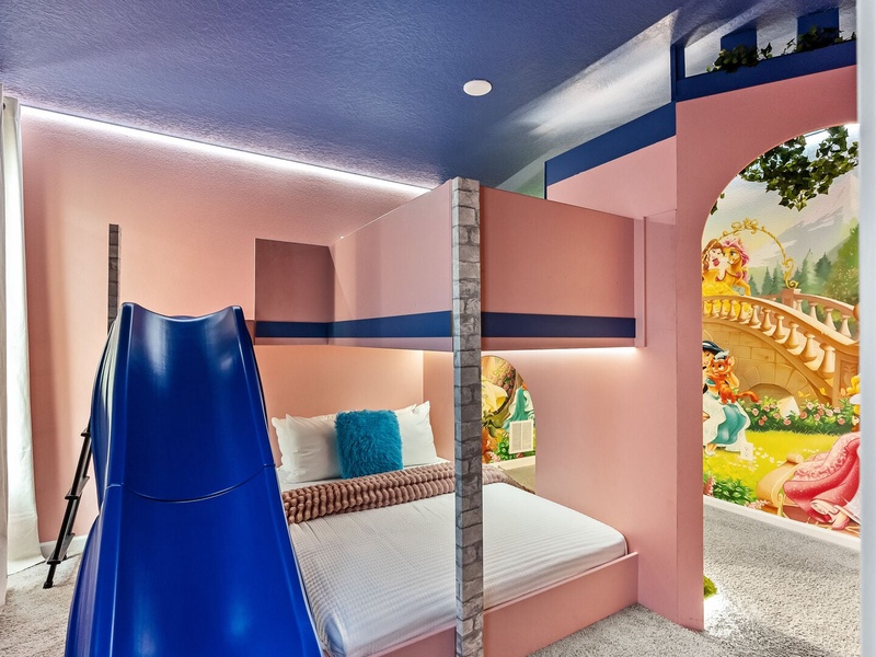 Sleep in a castle-shaped bunk bed with a fun slide fit for little royalty.