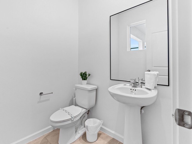 A social bathroom is conveniently located near the pool and living room for your convenience.
