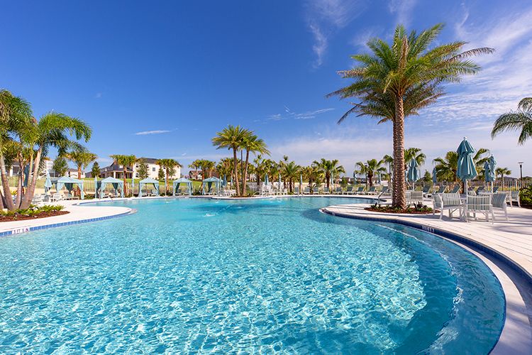 Dive into the expansive resort pool, perfect for relaxing or enjoying family fun.