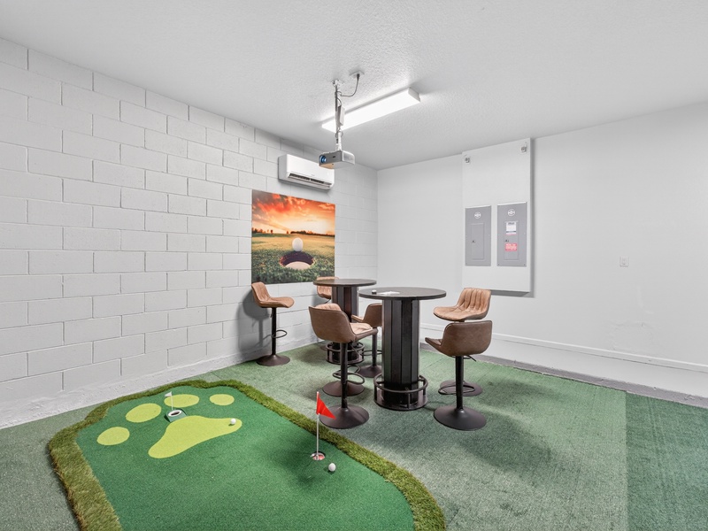 Practice your putting skills on the indoor putting green, perfect for friendly competitions and family fun.