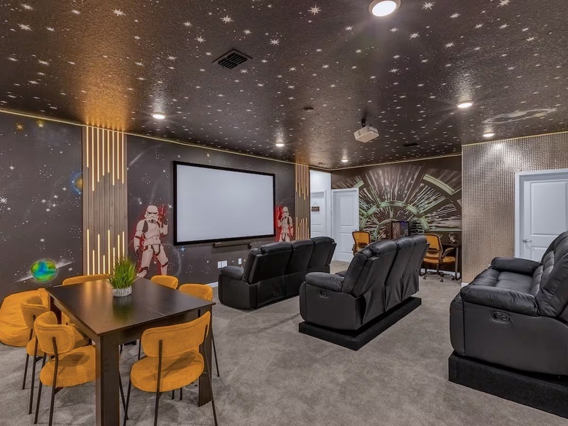 Settle in for movie nights in a dedicated cinema room featuring comfortable seating, a large screen, and an immersive entertainment experience.