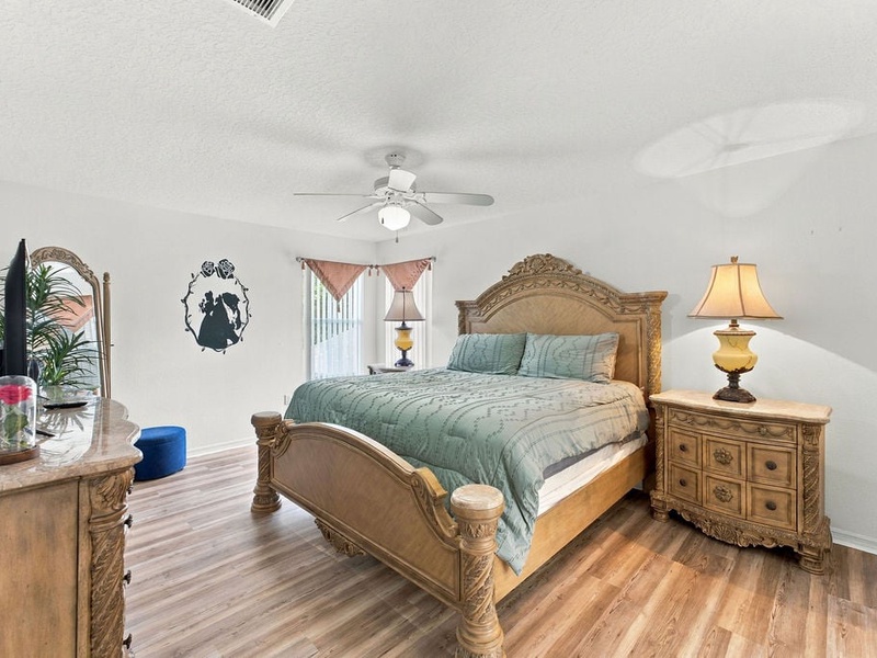 Comfortable bedroom with a king-style bed, TV, and relaxing vacation-home atmosphere.