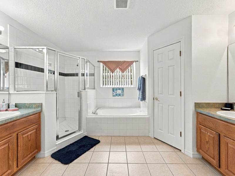 Clean bathroom details with fresh towels and practical amenities for guests.