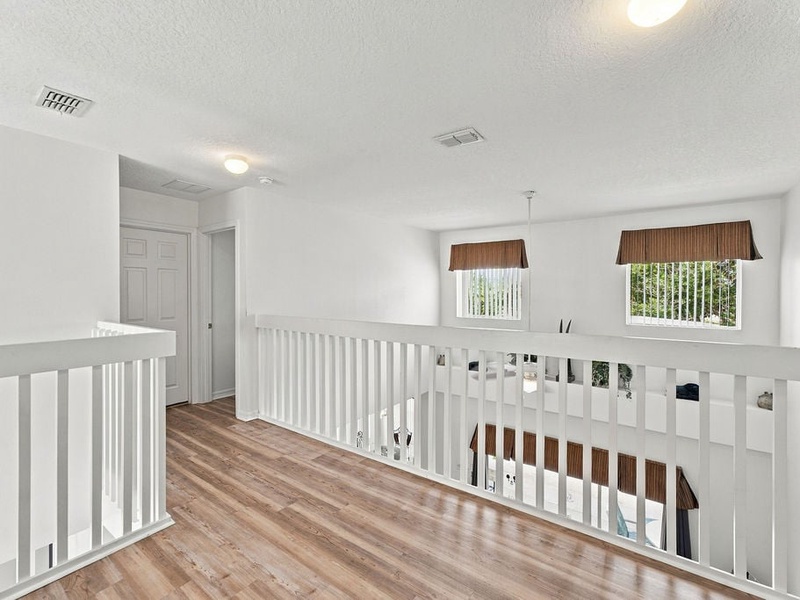 Bright upstairs landing connecting the bedrooms and living spaces.