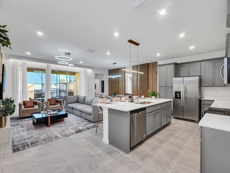 Enjoy bright, airy open-concept spaces connecting the living room, dining area, and modern kitchen.