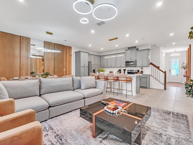 Bright, spacious living area with cozy seating and seamless access to the kitchen and dining area.
