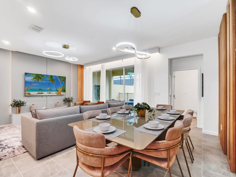 Bright, spacious living area with cozy seating and seamless access to the kitchen and dining area.